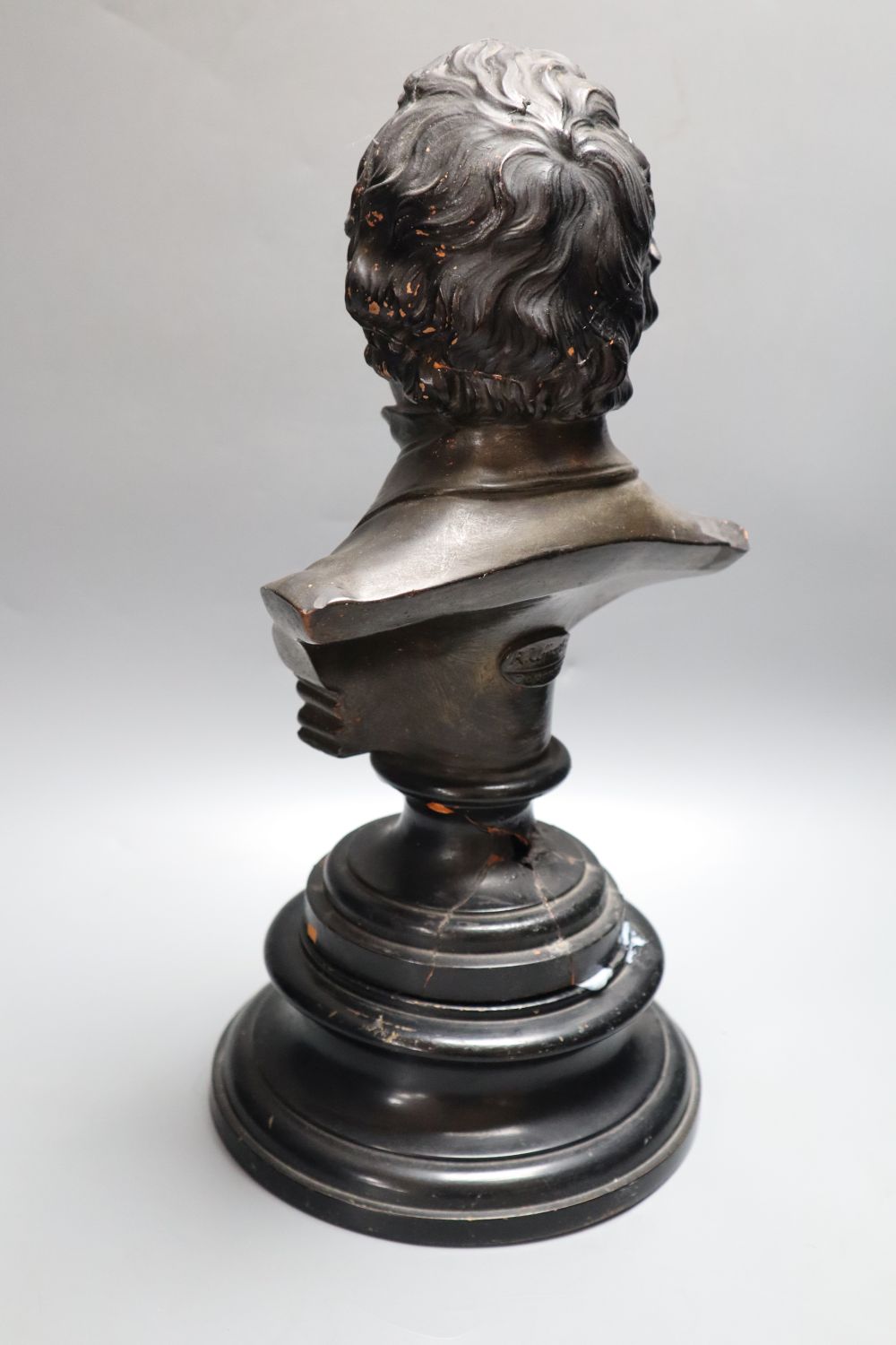 A painted terracotta bust of Disraeli, later plinth height 33cm